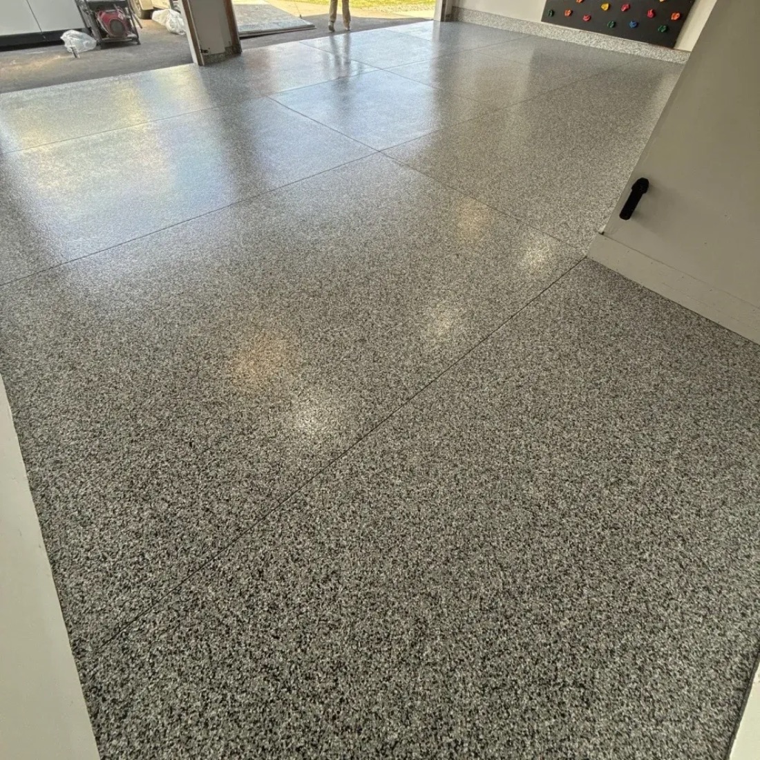 Gray flake garage floor coating by Endless Poxybilities